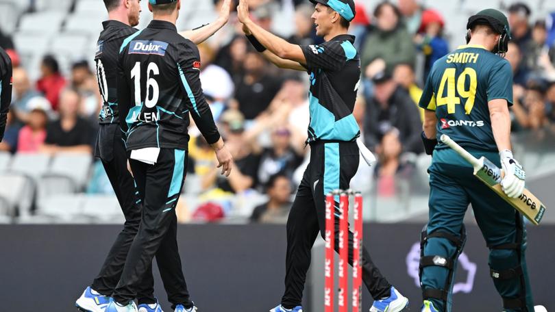 Adam Milne celebrates with Trent Boult after taking the wicket of Steve Smith on Sunday.