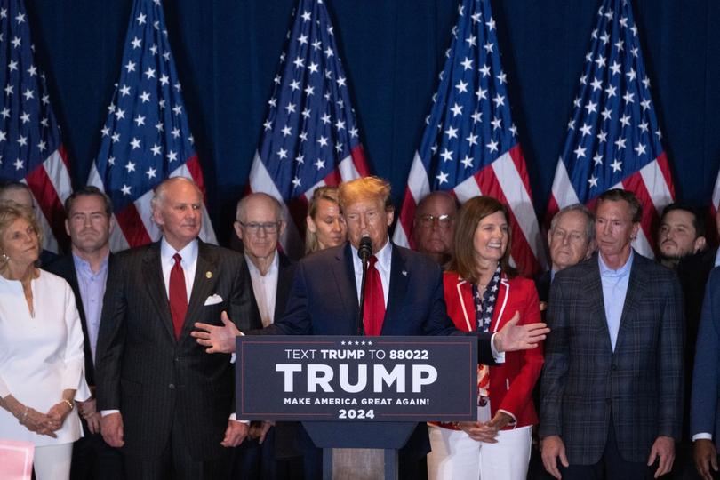 Former US President Donald Trump, centre, speaks during an election night watch party.