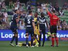 Referee Tim Danaskos shows Roderick Miranda of the Victory a red card after a contest with Mariner Alou Kuol.