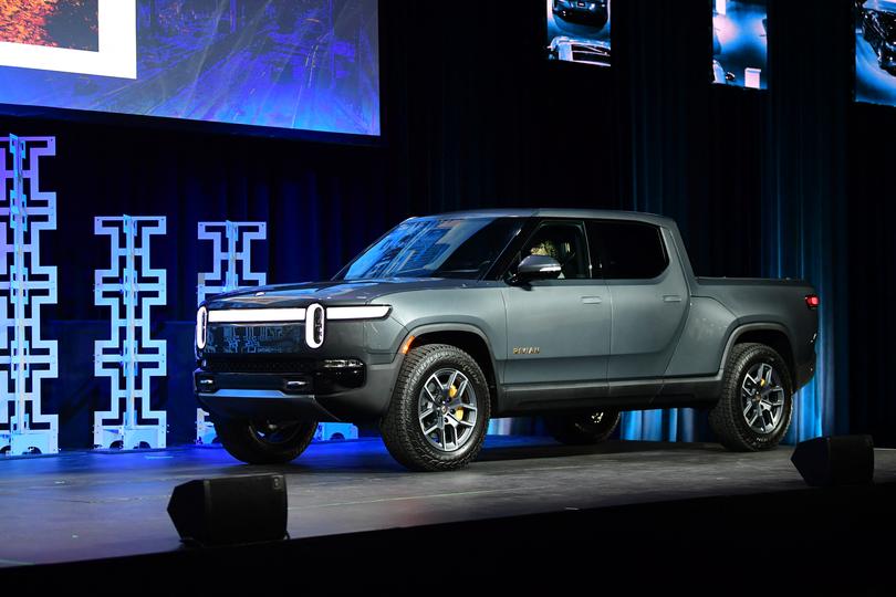 2022 Truck of the Year finalist Rivian R1T takes the stage at the 2021 LA Autoshow in Los Angeles, California on November 17, 2021. (Photo by FREDERIC J. BROWN / AFP)