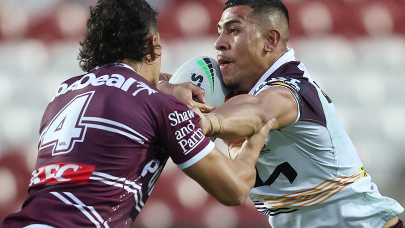 Sione Hopoate - a familiar surname to Sea Eagles fans -  is tackled by Manly’s Clayton Faulalo on Saturday.