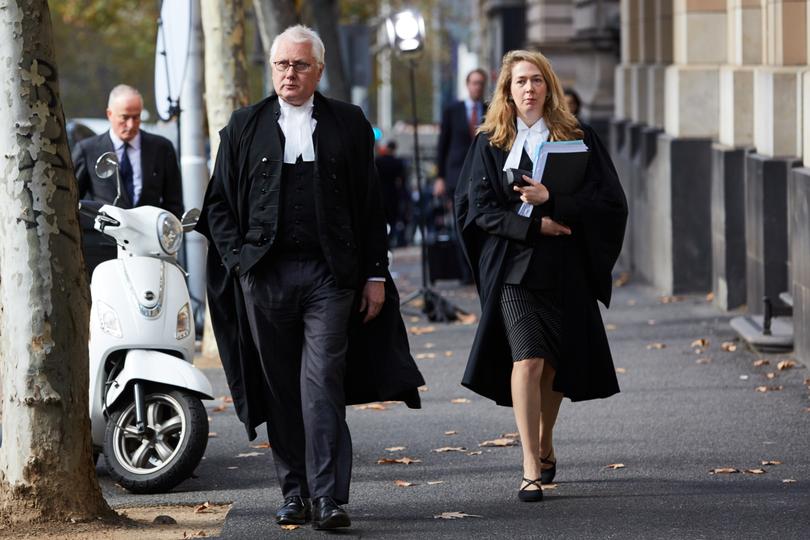 Defence barrister Bret Walker SC (left) and Defence barrister Ruth Shann return to the Supreme Court of Victoria after a lunch break in Melbourne, Thursday, June 6, 2019. Pell is appealing his conviction for sexually abusing two boys in the 1990s. (AAP Image/Erik Anderson) NO ARCHIVING