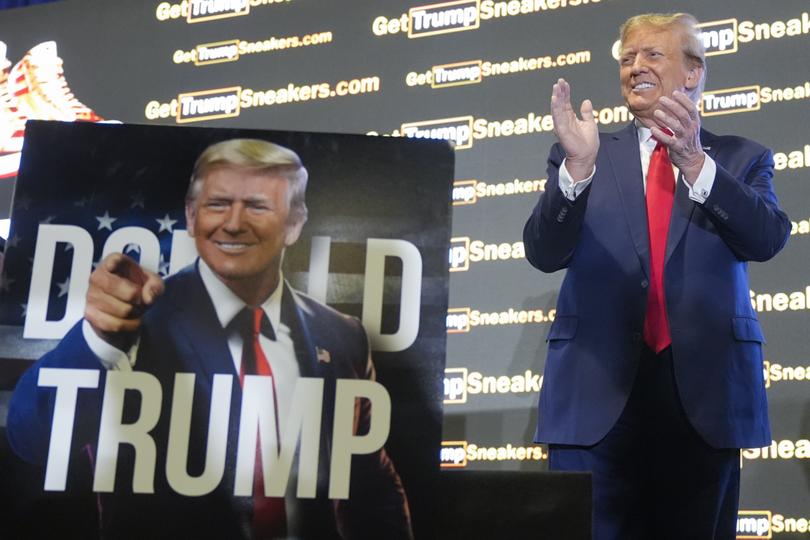 Republican presidential candidate former President Donald Trump gestures to the crowd at Sneaker Con Philadelphia, an event popular among sneaker collectors, in Philadelphia, Saturday, Feb. 17, 2024. (AP Photo/Manuel Balce Ceneta)