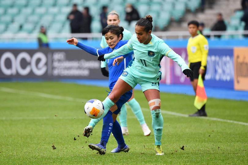 TASHKENT, UZBEKISTAN - FEBRUARY 24: Mary Fowler of Australia controls the ball whilst under pressure during the AFC Women's Paris 2024 Olympic Qualifier Round 3 match between Uzbekistan and Australia Matildas at Milliy Stadium on February 24, 2024 in Tashkent, Uzbekistan. (Photo by Tolib Kosimov/Getty Images)