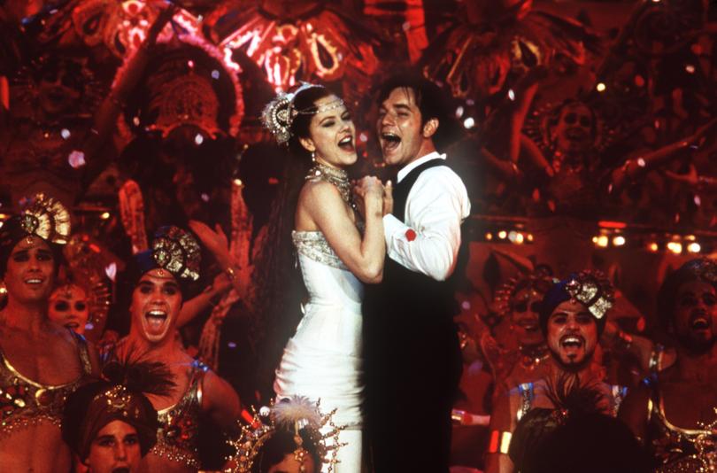 TO GO WITH STORY TITLED OSCARS MUSICALS--Nicole Kidman and Ewan McGregor perform a song-and-dance number in the musical "Moulin Rouge," one of the five films nominated for a best- picture Oscar. "Moulin Rouge" was the first live-action musical nominated for best picture since "All That Jazz" 22 years ago. (AP Photo/20th Century Fox, Sue Adler)