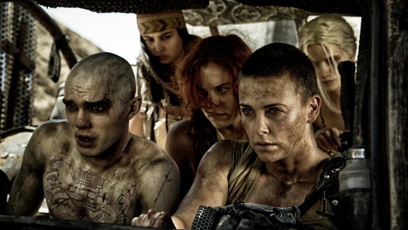 This photo released by Warner Bros. Pictures shows, from left, Riley Keough as Capable (Brainy), Courtney Eaton as Fragile (Cheedo), Charlize Theron as Furiosa, Nicholas Hoult as Nux, PHS-4, and Abbey Lee Kershaw as Wag (Smiley), in a scene from the film, "Mad Max: Fury Road." The film releases in the U.S. on May 15, 2015. (AP Photo/Warner Bros. Pictures, Jason Boland)