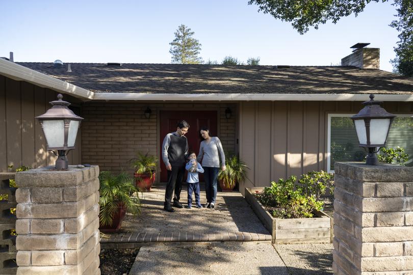 From left, Dr. Kevin Wang, his son Liam, and Dr. Ann Marqueling, mother of Liam, at their home in Palo Alto.