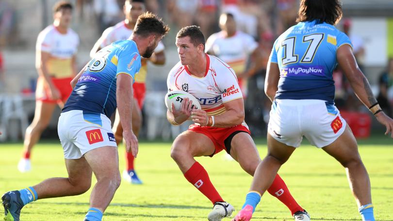 Tom Gilbert of the Dolphins takes on the defence during the NRL Pre-season challenge match between the Dolphins and Gold Coast Titans.
