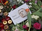 A photo of Russian opposition figure Aleksei Navalny laid in front of the Russian Embassy after his death.
