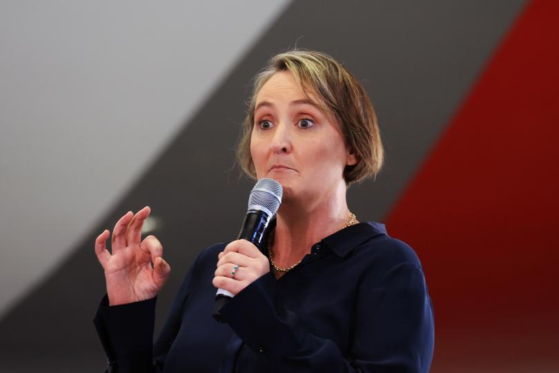 SYDNEY, AUSTRALIA - FEBRUARY 22: Qantas chief executive Vanessa Hudson speaks during a media opportunity at Hangar 96, Qantas Sydney Jet Base on February 22, 2024 in Sydney, Australia. Qantas has demonstrated a significant financial turnaround, reporting a record $2.47 billion profit for the 2022-23 fiscal year, marking a stark change from the previous year's $1.86 billion loss. The airline's strong performance was attributed to robust travel demand and high ticket prices, with domestic earnings before interest and taxes (EBIT) jumping to 18.2%, representing a 50% increase in profit margins over the past six years. The company's return on invested capital also increased to 103.6%, reflecting its improved financial position and operational performance. (Photo by Jenny Evans/Getty Images)