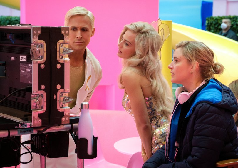 This image released by Warner Bros. Pictures shows actors Ryan Gosling, left, Margot Robbie, center, with director Greta Gerwig on the set of "Barbie." (Jaap Buitendijk/Warner Bros. Pictures via AP)