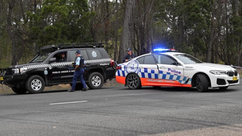 Police at Bungonia where the bodies of two murdered men were found.