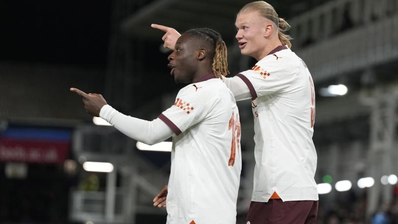 Manchester City's Erling Haaland, right, celebrates with his teammate Jeremy Doku after scoring his side's third goal during the FA Cup win over Luton Town.