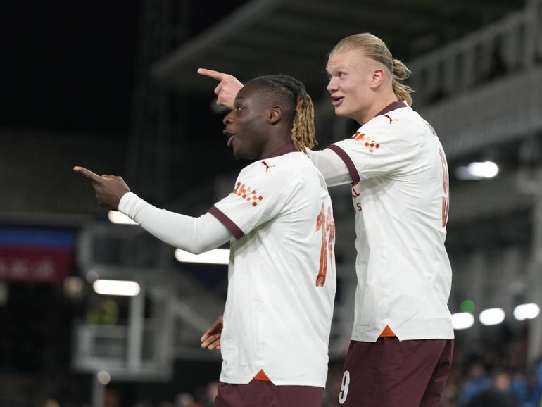 Manchester City's Erling Haaland, right, celebrates with his teammate Jeremy Doku after scoring his side's third goal during the FA Cup win over Luton Town.