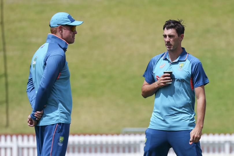 WELLINGTON, NEW ZEALAND - FEBRUARY 26: Coach Andrew McDonald and captain Pat Cummins of Australia talk during a training session ahead of the First Test in the series between New Zealand and Australia at Basin Reserve on February 26, 2024 in Wellington, New Zealand. (Photo by Hagen Hopkins/Getty Images)