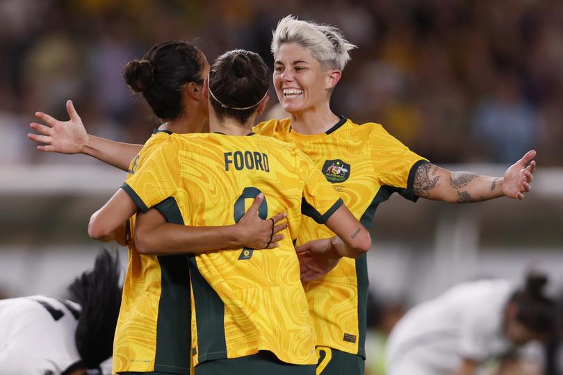 MELBOURNE, AUSTRALIA - FEBRUARY 28: Mary Fowler of the Matildas celebrates a goal with team mates Caitlin Foord and Michelle Heyman during the AFC Women's Olympic Football Tournament Paris 2024 Asian Qualifier Round 3 match between Australia Matildas and Uzbekistan at Marvel Stadium on February 28, 2024 in Melbourne, Australia. (Photo by Darrian Traynor/Getty Images)