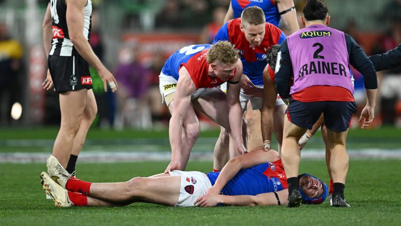 The pain of the parents is rarely spoken about when it comes to athletes and concussion. Pictured: Angus Brayshaw after a big hit. 