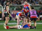 The pain of the parents is rarely spoken about when it comes to athletes and concussion. Pictured: Angus Brayshaw after a big hit. 
