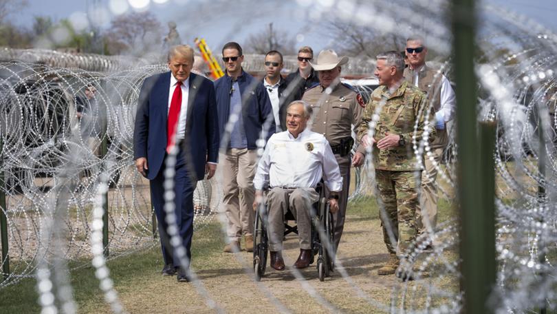 Former President Donald Trump and Texas Gov. Greg Abbott meet with members of the Texas National Guard.