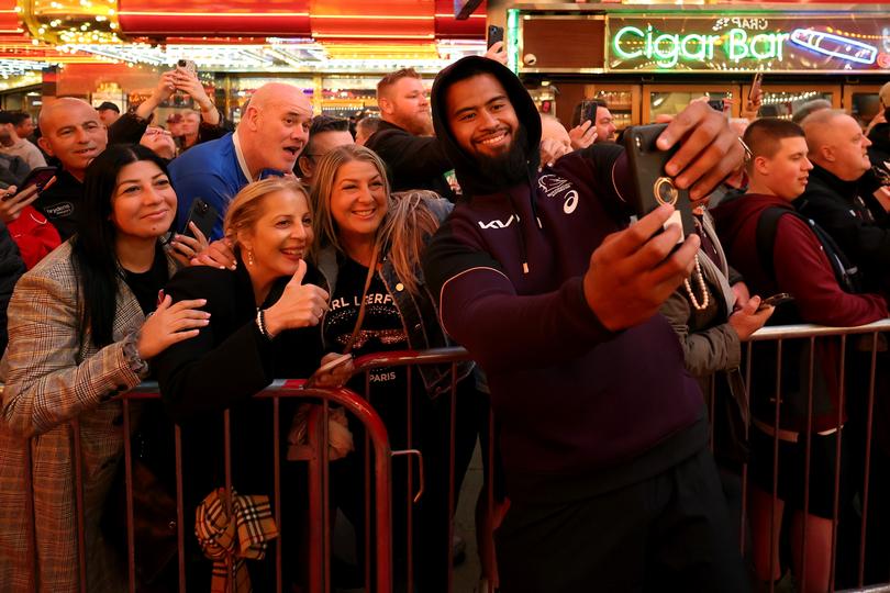 LAS VEGAS, NEVADA - FEBRUARY 29: Payne Haas of the Brisbane Broncos takes a selfie with fans during the NRL season launch at Fremont Street Experience on February 29, 2024, in Las Vegas, Nevada. (Photo by Ezra Shaw/Getty Images)