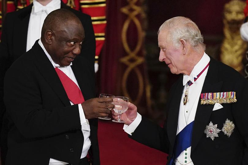 Britain's King Charles III, right, and South Africa's President Cyril Ramaphosa toast during the State Banquet at Buckingham Palace, London, Tuesday Nov. 22, 2022. (Aaron Chown/PA via AP)