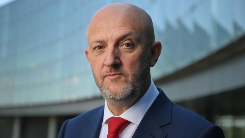 Australian Security Intelligence Organisation ASIO Director General Mike Burgess poses for a portrait ahead of his annual speech at ASIO headquarters in Canberra, Tuesday, February 21, 2023. (AAP Image/Mick Tsikas) NO ARCHIVING