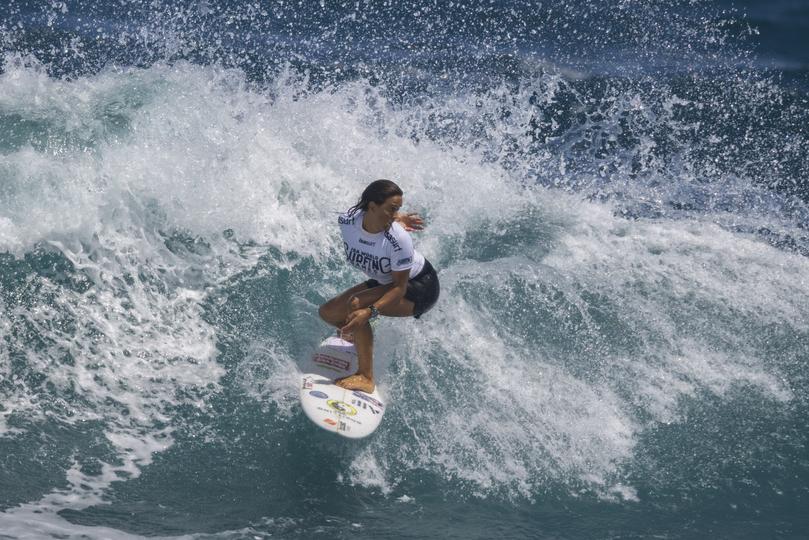 Sally Fitzgibbons from Australia competes in the final of the ISA World Surfing Games, a qualifier for the Paris 2024 Olympic Games, off La Marginal beach in Arecibo, Puerto Rico, Sunday, March 3, 2024. (AP Photo/Alejandro Granadillo)