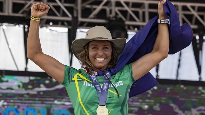 Sally Fitzgibbons of Australia, celebrates winning the gold medal at the final of the ISA World Surfing Games.