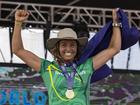 Sally Fitzgibbons of Australia, celebrates winning the gold medal at the final of the ISA World Surfing Games.