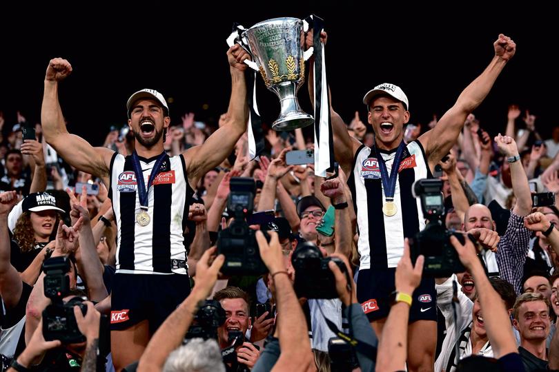 MELBOURNE, AUSTRALIA - SEPTEMBER 30: Josh Daicos of the Magpies and Nick Daicos of the Magpies celebrates winning the premiership during the 2023 AFL Grand Final match between Collingwood Magpies and Brisbane Lions at Melbourne Cricket Ground, on September 30, 2023, in Melbourne, Australia. (Photo by Quinn Rooney/Getty Images via AFL Photos)