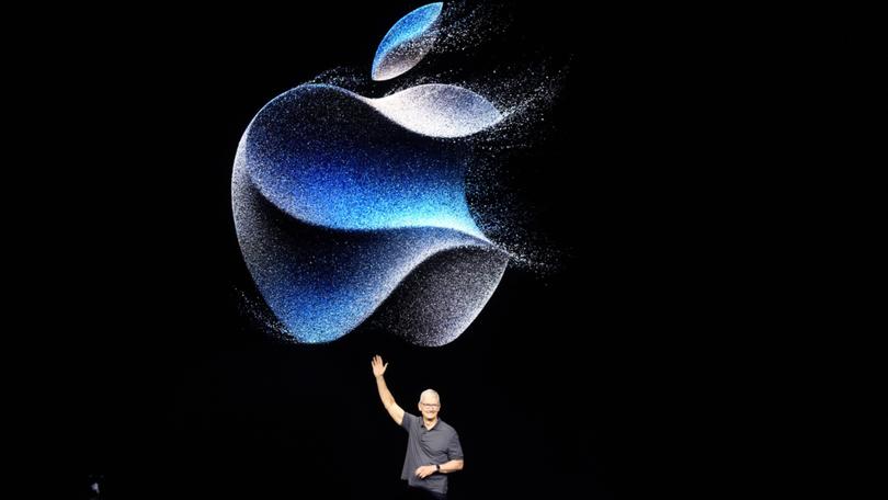 File - Apple CEO Tim Cook waves at an announcement of new products on Sept. 12, 2023, in Cupertino, Calif. On Thursday, Feb. 1, 2024, Apple will release its results for the holiday season against a backdrop of legal headaches, ongoing worries about a yearlong dip in revenue and intrigue surrounding the upcoming release of its hotly anticipated mixed-reality headset. (AP Photo/Jeff Chiu, File)