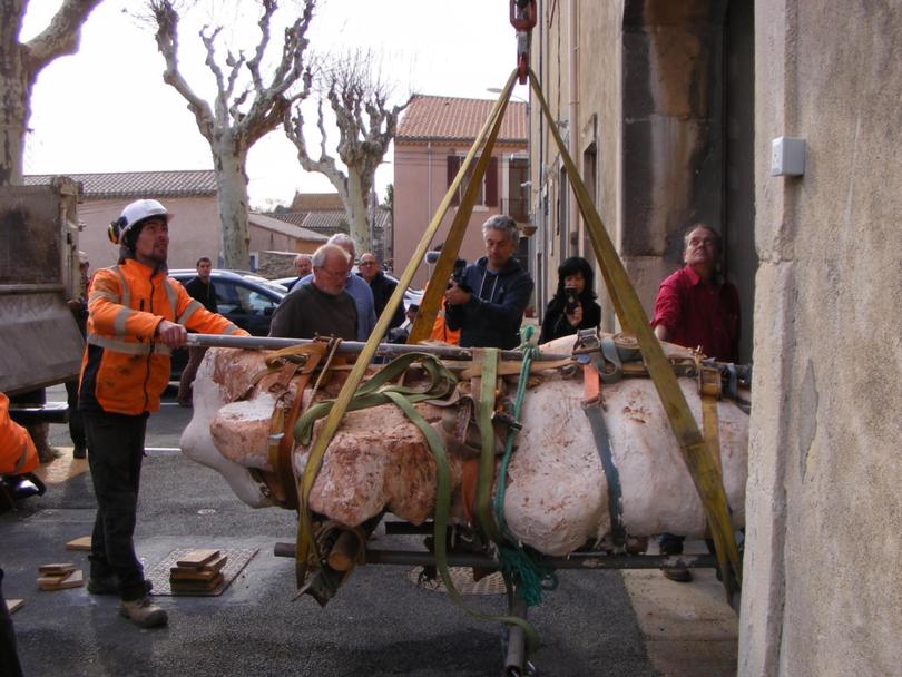 An archeological team transports a dinosaur bone from the site in southern France found by Damien Boschetto. 