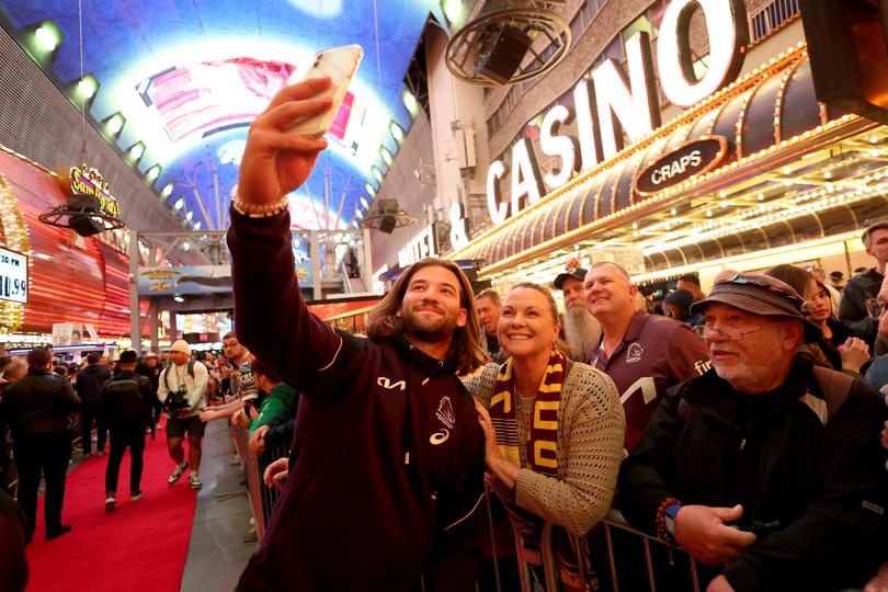 Pat Carrigan of the Brisbane Broncos takes a selfie with fan.