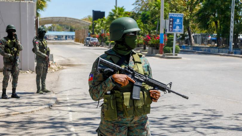 Soldiers guard the entrance of the international airport in Port-au-Prince in Haiti.