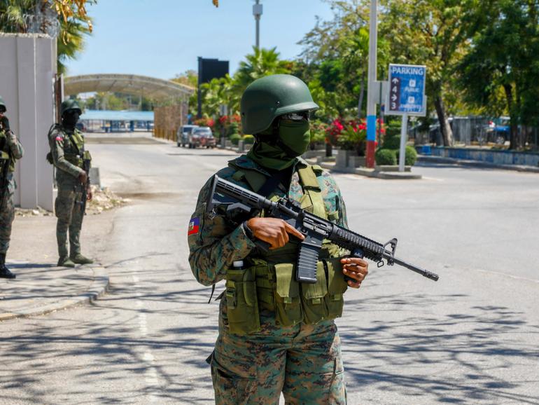 Soldiers guard the entrance of the international airport in Port-au-Prince in Haiti.