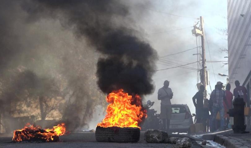 Tyres on fire near the main prison of Port-au-Prince, Haiti, on March 3, 2024, after a breakout by several thousand inmates. 