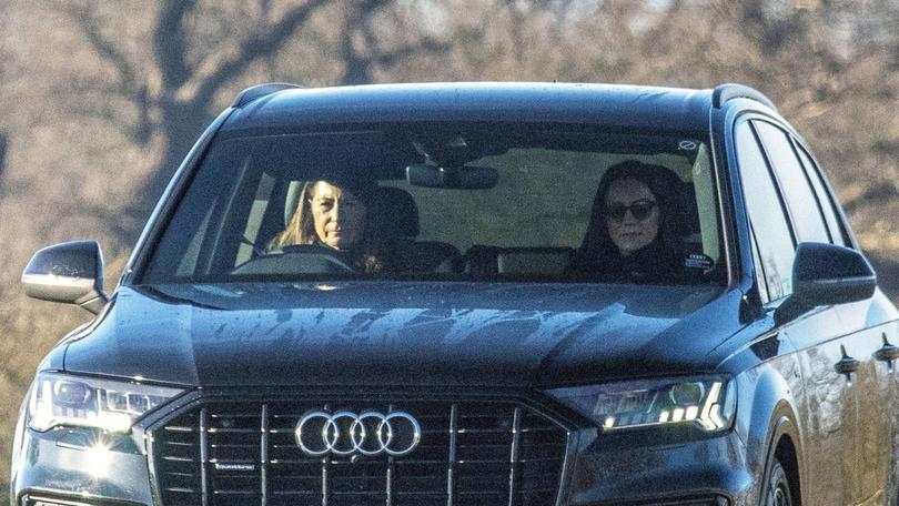 Carole Middleton drives while her daughter Kate rides along in the passenger seat.