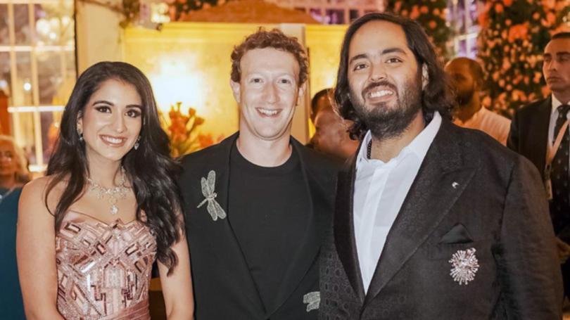 Mark Zuckerberg, centre, posing for a photograph with billionaire industrialist Mukesh Ambani's son Anant Ambani and his wife to be Radhika Merchant.