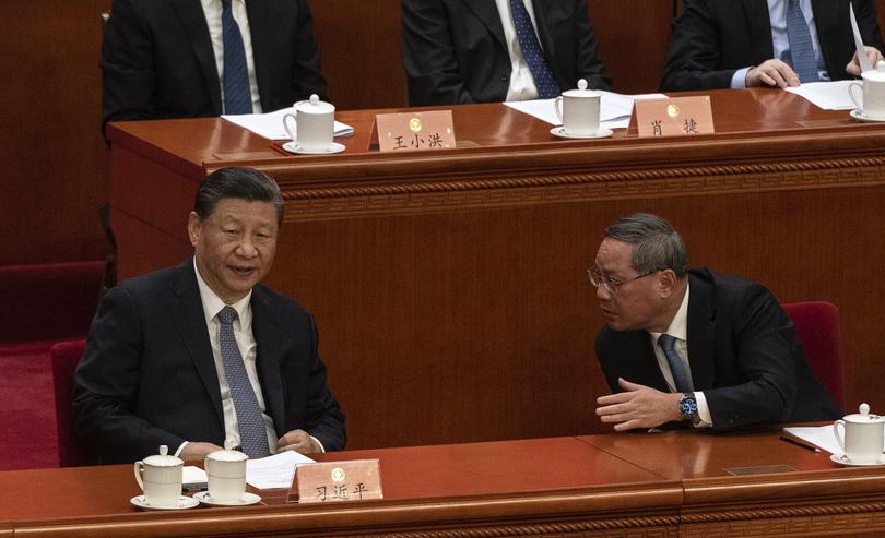 BEIJING, CHINA - MARCH 4: Chinese leader Xi Jinping (L) and Premier Li Qiang attend the annual Two Sessions meetings on March 4, 2024 in Beijing, China. China's annual political gathering known as the Two Sessions will convene leaders and lawmakers to set the government's agenda for domestic economic and social development for the year.  (Photo by Kevin Frayer/Getty Images)