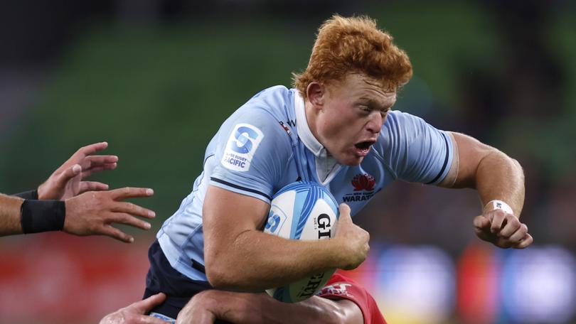 MELBOURNE, AUSTRALIA - MARCH 02: Tane Edmed of the Waratahs runs with the ball during the round two Super Rugby Pacific match between Crusaders and NSW Waratahs at AAMI Park, on March 02, 2024, in Melbourne, Australia. (Photo by Darrian Traynor/Getty Images)