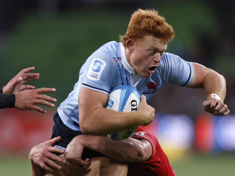 MELBOURNE, AUSTRALIA - MARCH 02: Tane Edmed of the Waratahs runs with the ball during the round two Super Rugby Pacific match between Crusaders and NSW Waratahs at AAMI Park, on March 02, 2024, in Melbourne, Australia. (Photo by Darrian Traynor/Getty Images)