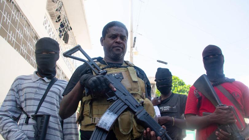 Armed gang leader Jimmy "Barbecue" Cherisier and his men in Port-au-Prince,