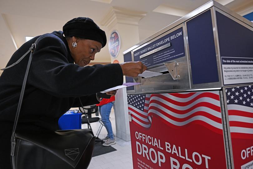A woman casts her vote in California.