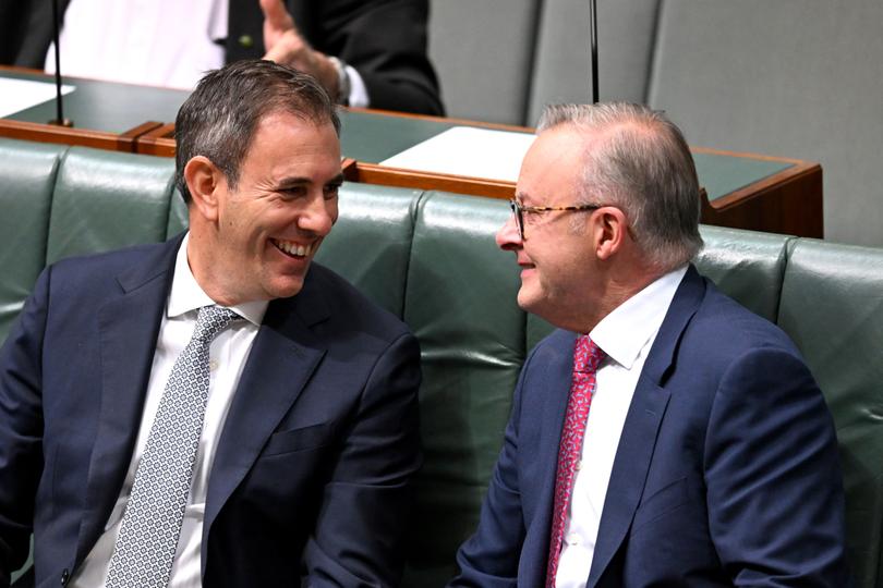 Australian Prime Minister Anthony Albanese and Australian Treasurer Jim Chalmers speak during debate on the Cost of Living Tax Cuts Bill in the House of Representatives at Parliament House in Canberra, Thursday, February 15, 2024. (AAP Image/Lukas Coch) NO ARCHIVING