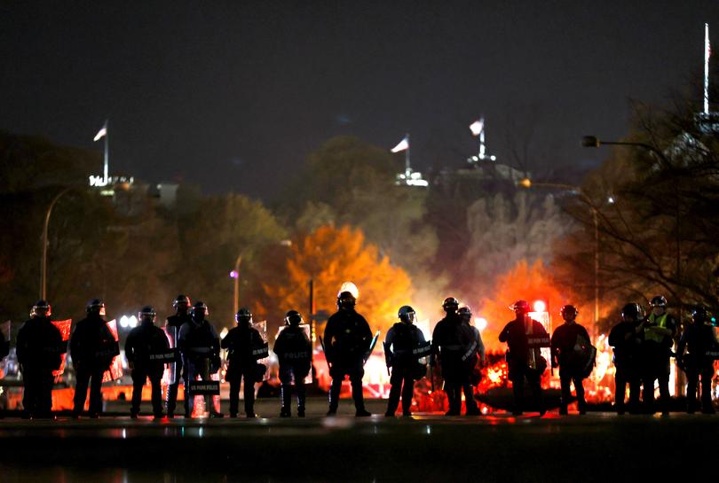 WASHINGTON, DC - NOVEMBER 14: Police officers stand in line as they monitor a protest following the "Million MAGA March" from Freedom Plaza to the Supreme Court, on November 14, 2020 in Washington, DC. Supporters of U.S. President Donald Trump gathered to protest the outcome of the 2020 presidential election. (Photo by Tasos Katopodis/Getty Images)