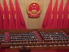 Chinese Premier Li Qiang stands at the podium during his speech at the opening of the National People's Congress, at the Great Hall of the People on Tuesday.
