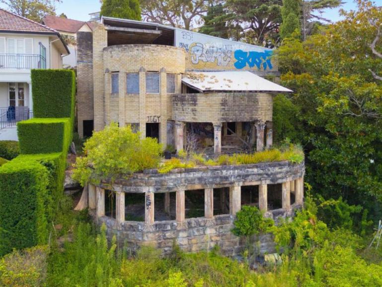 A dilapidated mansion frequented by squatters is on the market.