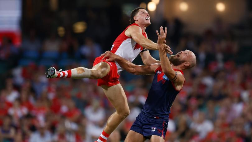 Hayden McLean and Max Gawn compete in the round zero mnatch in Sydney.