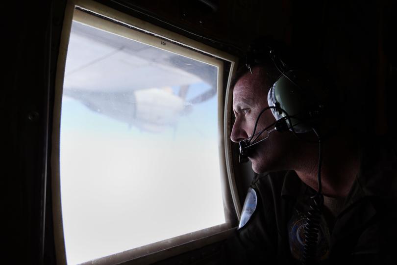 An RAAF C-130J Hercules assists with the search for missing Malaysian Airlines Flight MH370 off the coast of Western Australia.