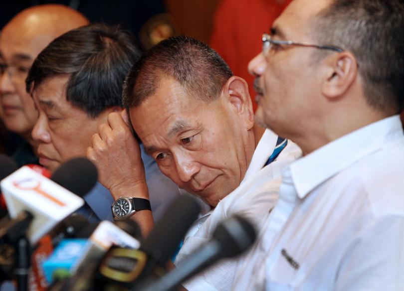 Ahmad Jauhari Yahya, chief executive officer of Malaysian Airline System Bhd., second right, listens at a news conference in Sepang, Malaysia.